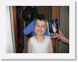 IMG_0169 * I'm only doing this because I'm far to young to understand... Rasi with a picture of Nick when she was 3 dressed as a nurse. * 2592 x 1944 * (886KB)