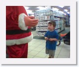 Image024_rasmeetssanta * The big red mecahnical santa was just a little bit scary, but not enough to instil a fear of presents... :) * 352 x 288 * (12KB)